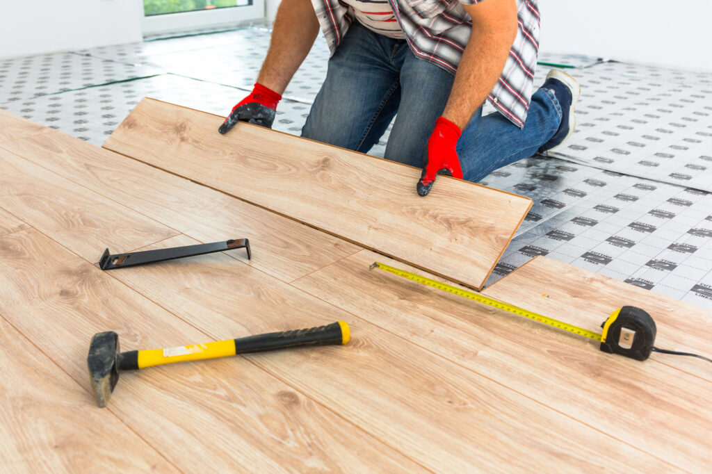 Handyman Installing New Laminated Wooden Floor