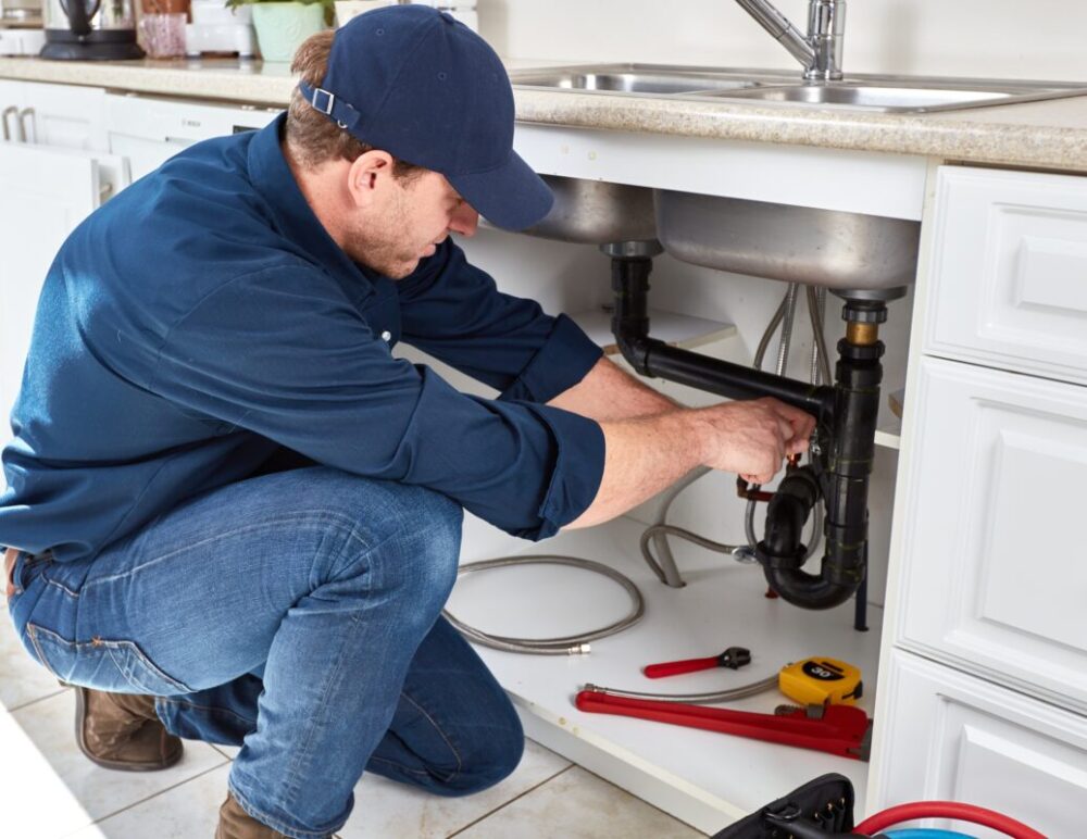 Plumber Fixing Sink