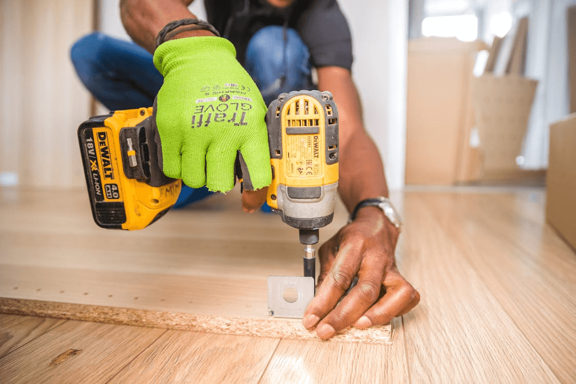 A remodeling contractor using a drill